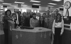 staffatdesk Library staff gather around the new front desk.